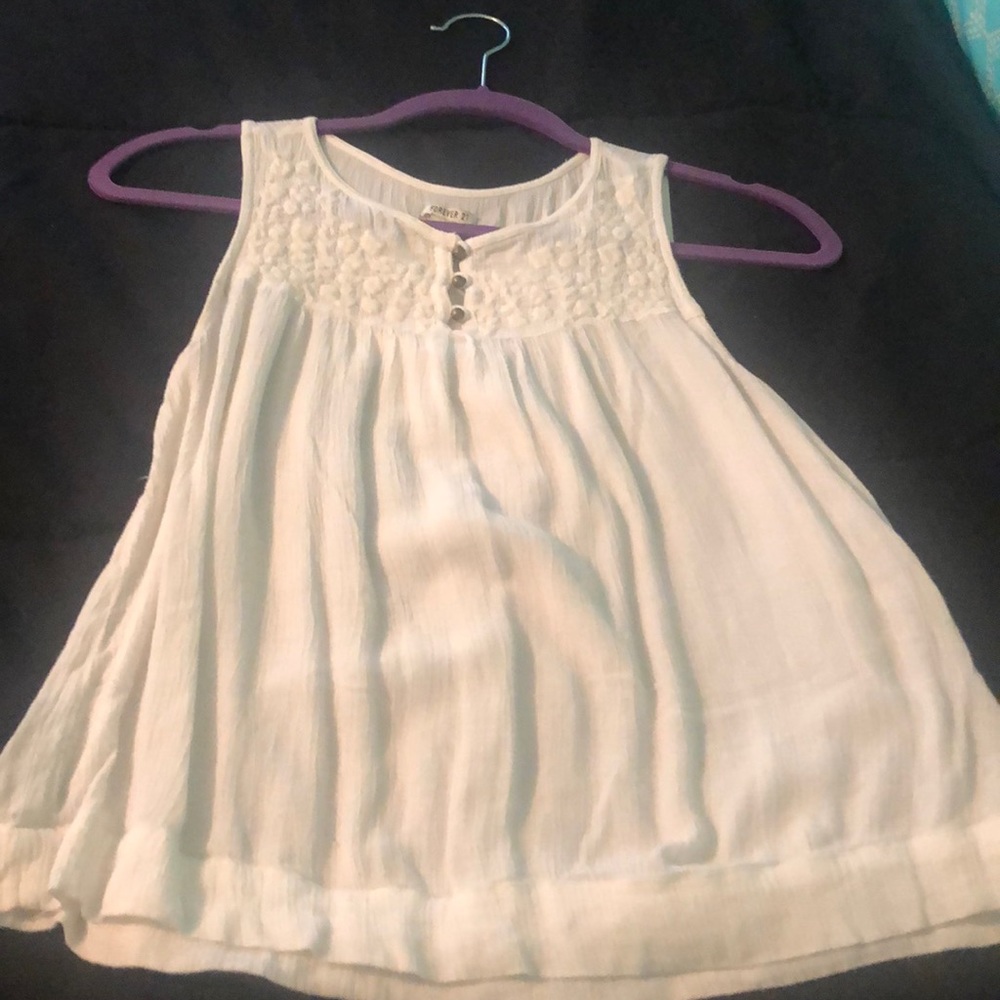 White sleeveless top